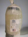 Gallon container of 'Flex' product with a label on a gray background
